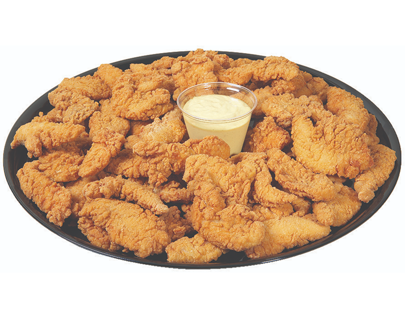 Plate of fried chicken with a creamy dipping sauce on a white background